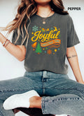Pepper: Woman wearing a pepper grey vintage Joyful Christmas Time t shirt with retro holiday graphic and reindeer