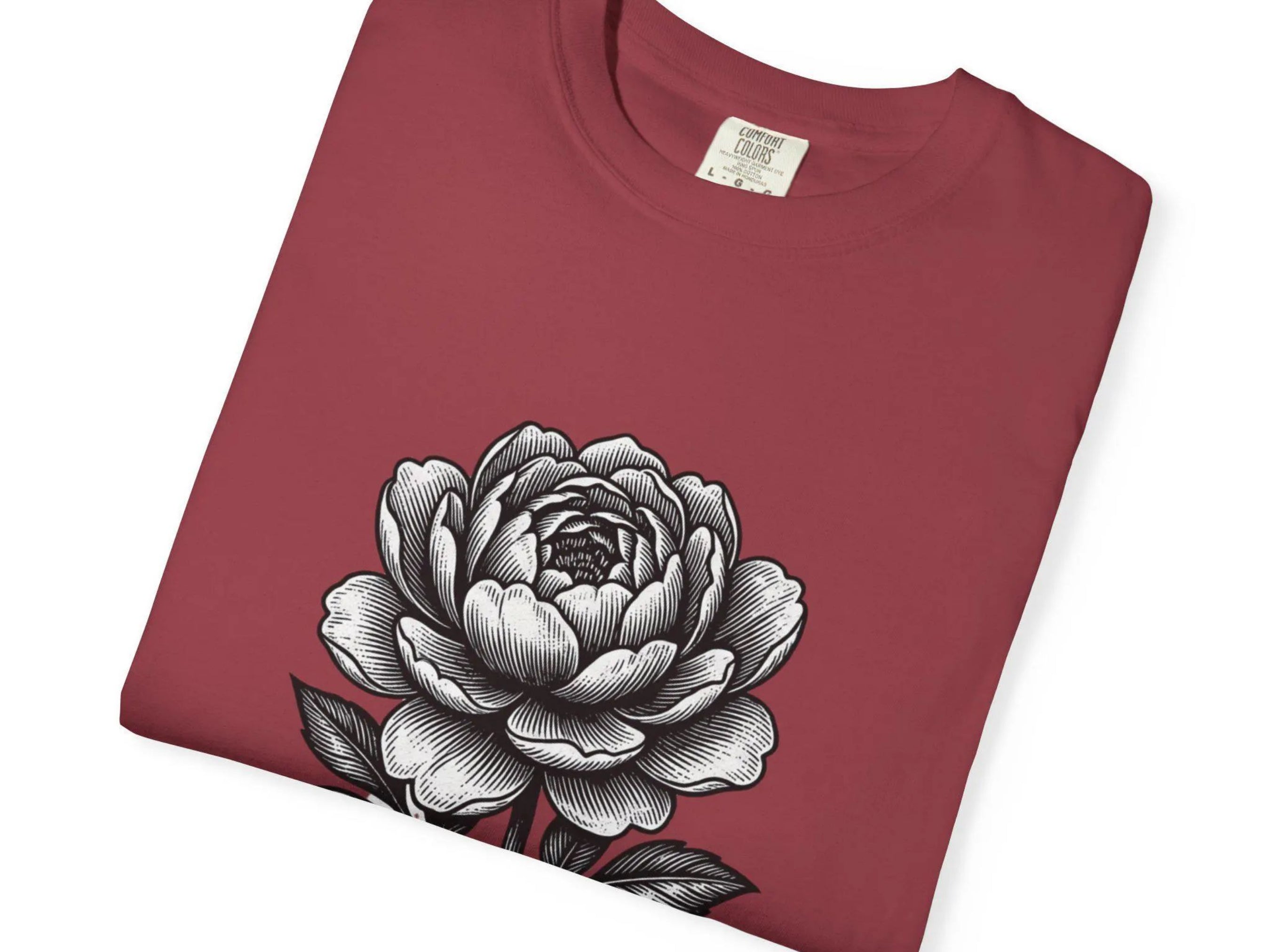 Maroon t-shirt with a black and white floral design on a white background