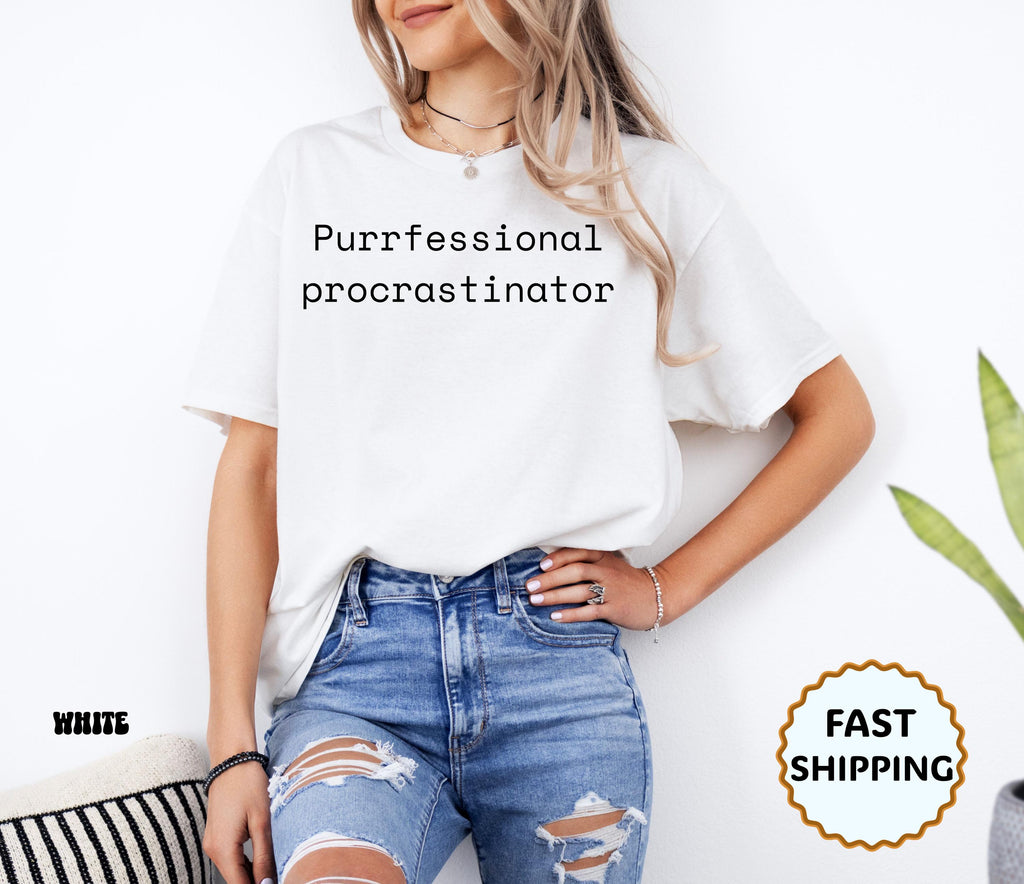 White: Woman wearing a white t-shirt with black text reading Purrfessional procrastinator