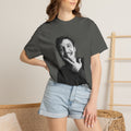 Person wearing a t-shirt with a graphic design of a man's face.